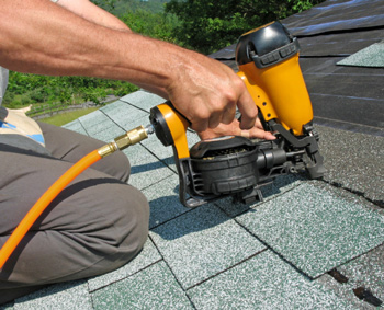 A professional roofing contractor working on a home in Clarence, NY